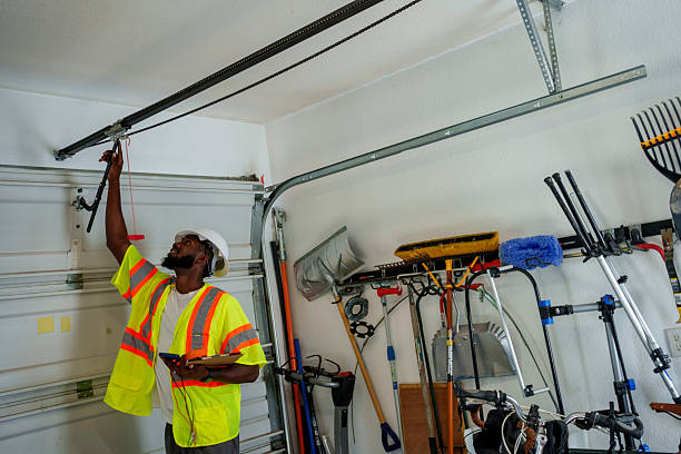 Professional Garage Door Panel Replacement technician working in Tioga, ND